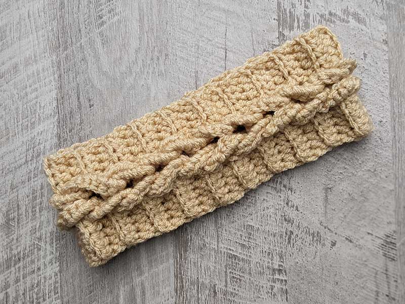 latte coloured crochet headband with cable imitation