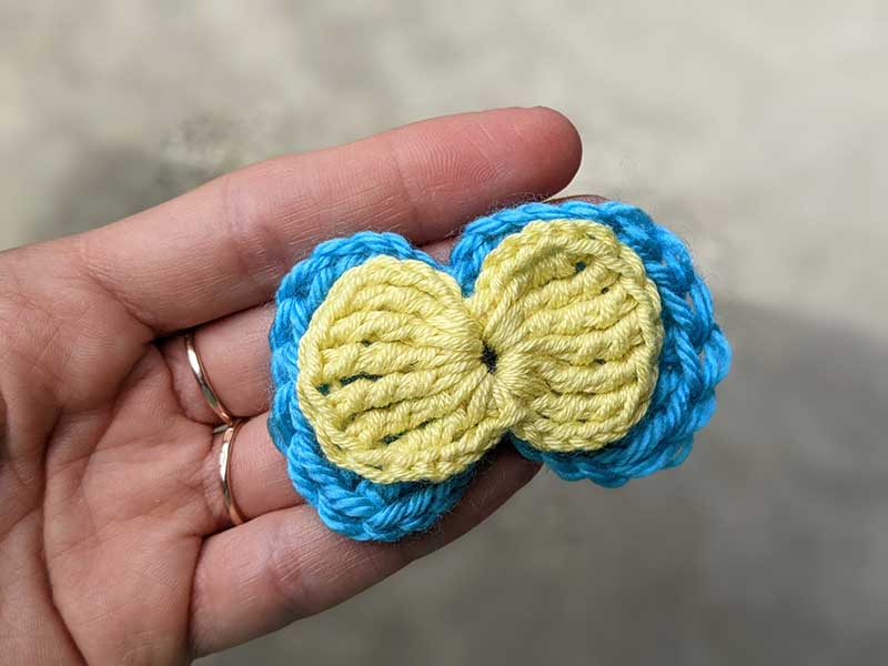 two crochet bows - one yellow and one blue