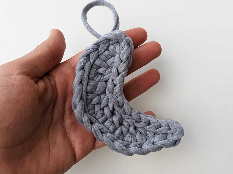 crochet moon made with gray yarn 