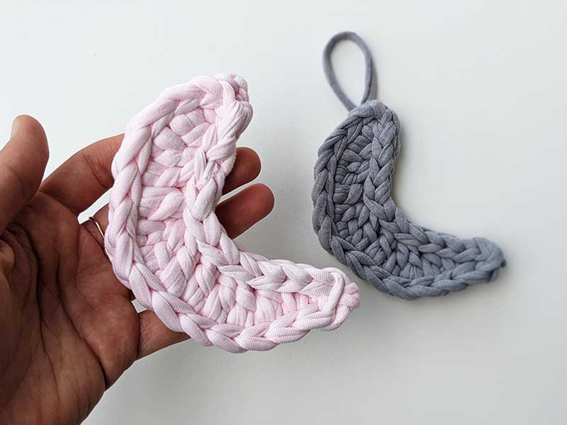 two crochet moons - one pink and one gray