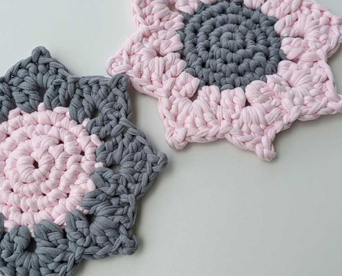 two crochet bicolored sunflower hot pads
