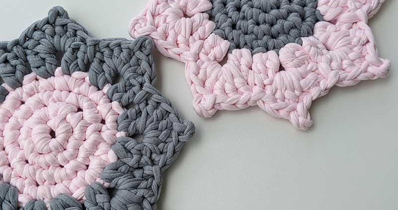 two crochet bicolored sunflower hot pads