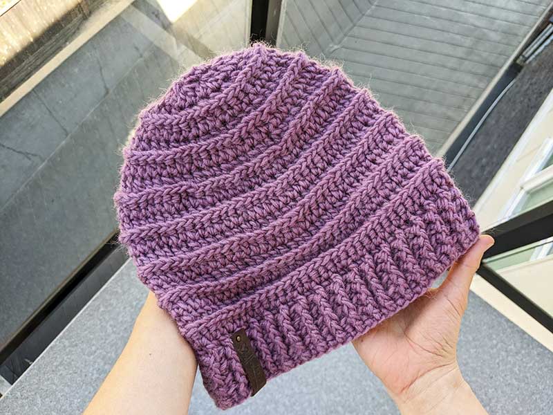 crochet beanie for women made with violet yarn