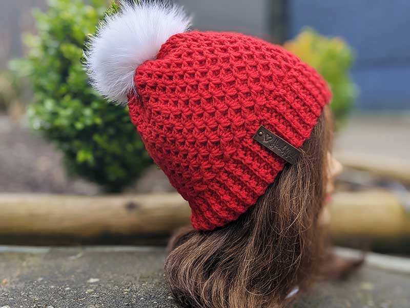 crochet diamond hat with fur pom - right side view