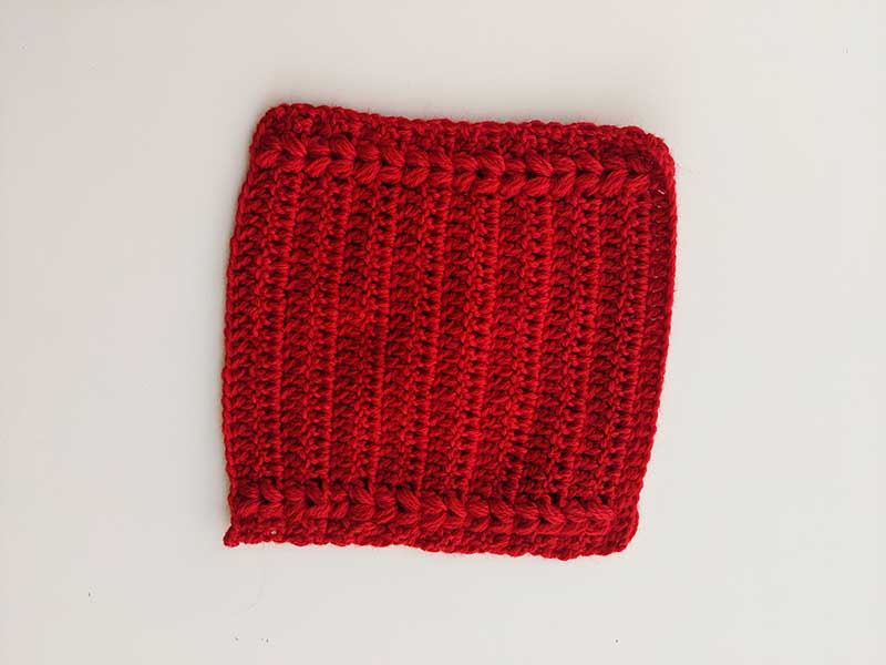 flat crochet red slipper sock - unassembled view