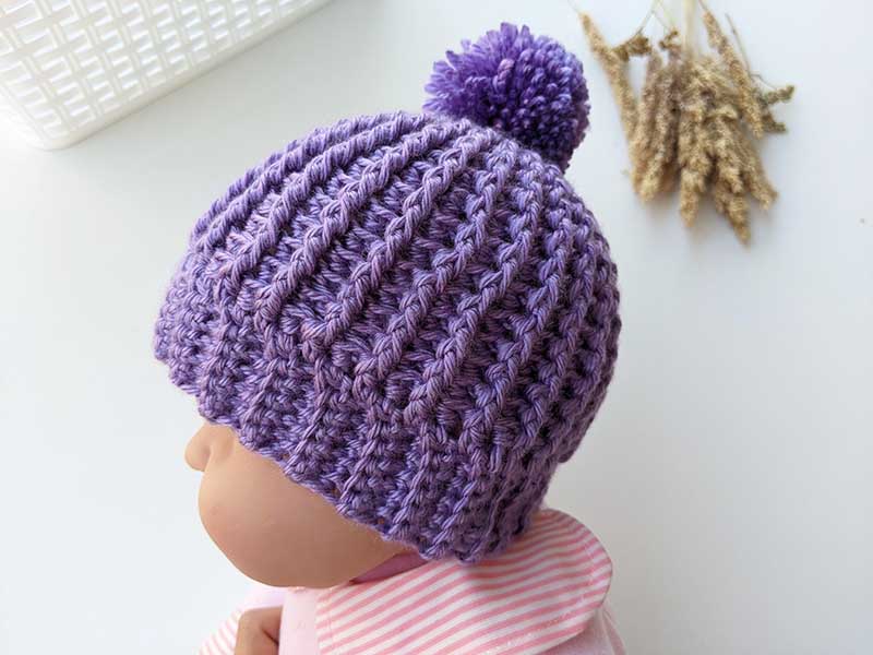 newborn baby crochet hat with yarn pom - side view