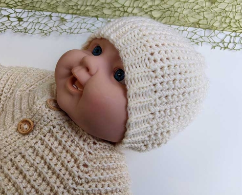 crochet newborn baby beanie hat on the mannequin
