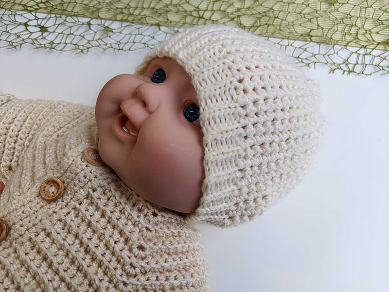 crochet newborn baby beanie hat on the mannequin