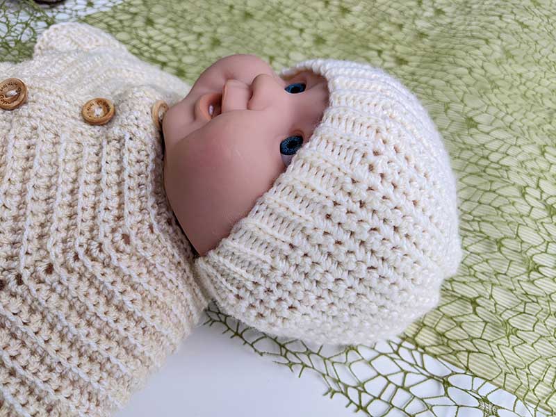 crochet newborn baby beanie on mannequin
