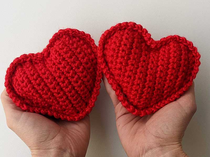 two crochet heart pillows