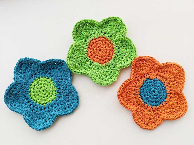 crochet flower hot pads - green, blue, and orange