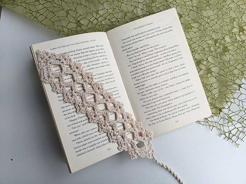 crochet lace bookmark featured in-between pages of the book