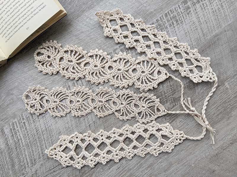 four crochet lace bookmarks in different styles