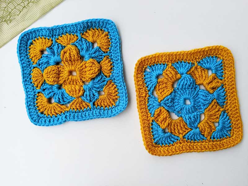 two crochet granny squares with alternating colours
