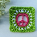 crochet piece sign granny sign with green as an accent color