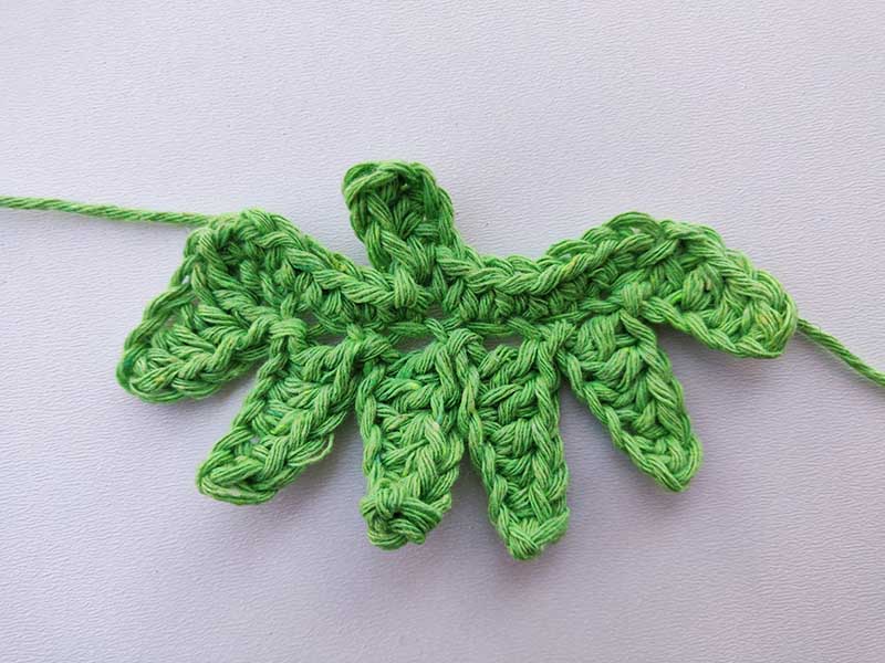 finished crochet strawberry leaves