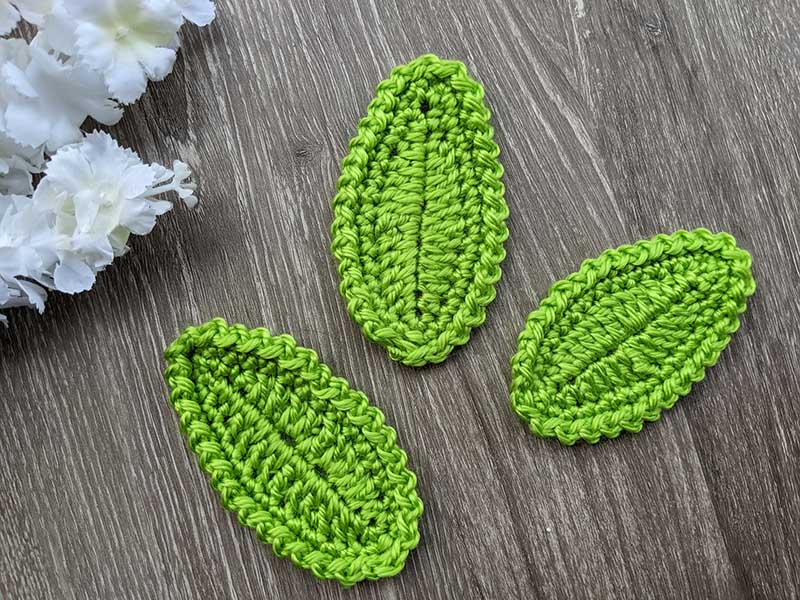 three crochet oval leaves arranged next to each other