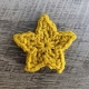 crochet five-point star made with yellow yarn