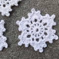 close up view of a lace crochet snowflake