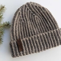 flat crochet men's ribbed hat on a flat surface