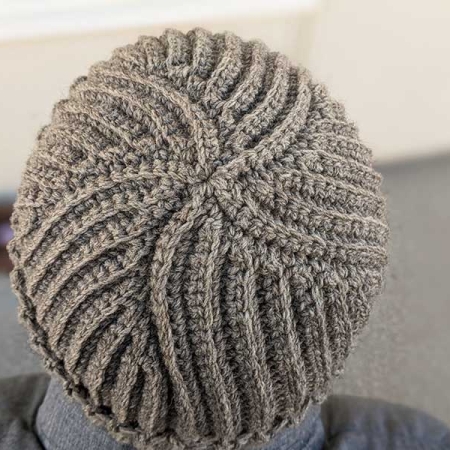 flat crochet ribbed hat on a male model - top view of the hat's crown