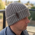 flat crochet ribbed hat on a male model - right side view