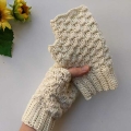 crochet fingerless gloves held in hands