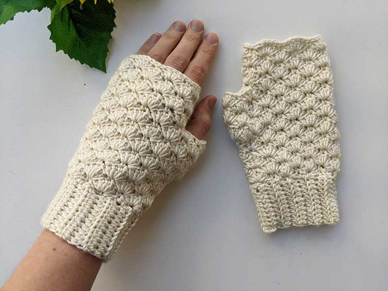 crochet fingerless gloves worn on hands