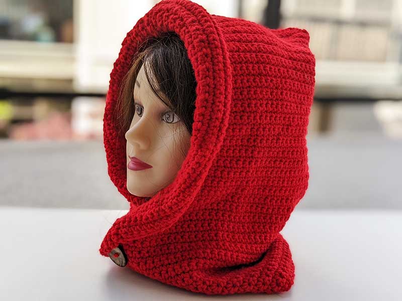 crochet little red riding hood on the mannequin's head