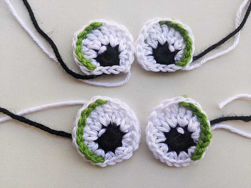 two pairs of crochet eyes with loose ends - oval and semi-oval