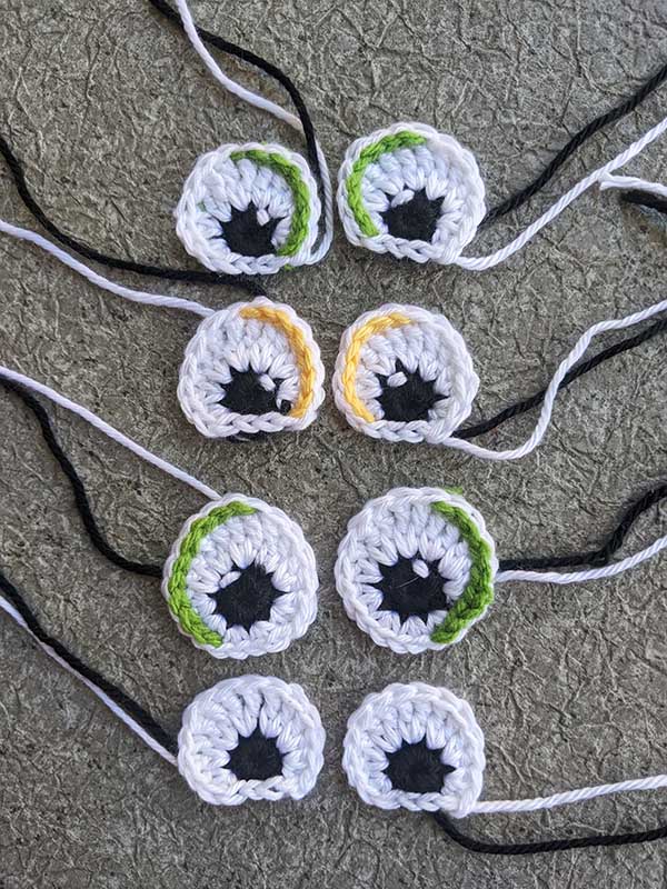 four pairs of crochet eyes with loose ends