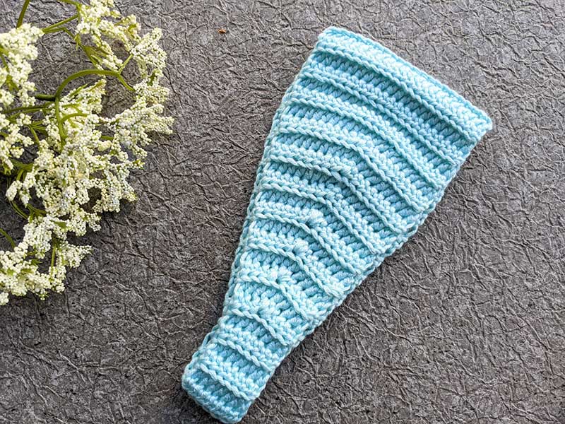 crochet headband with button closure - side view