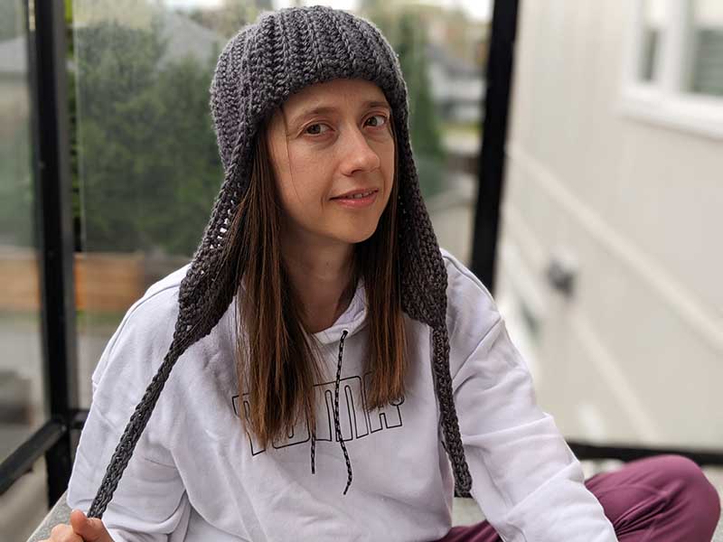 crochet women's trapper hat on a female model