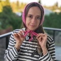 crochet bandana with ties on a female model - front view