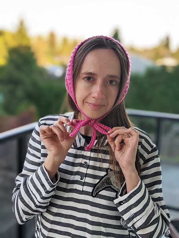 crochet bandana with ties on a female model - front view