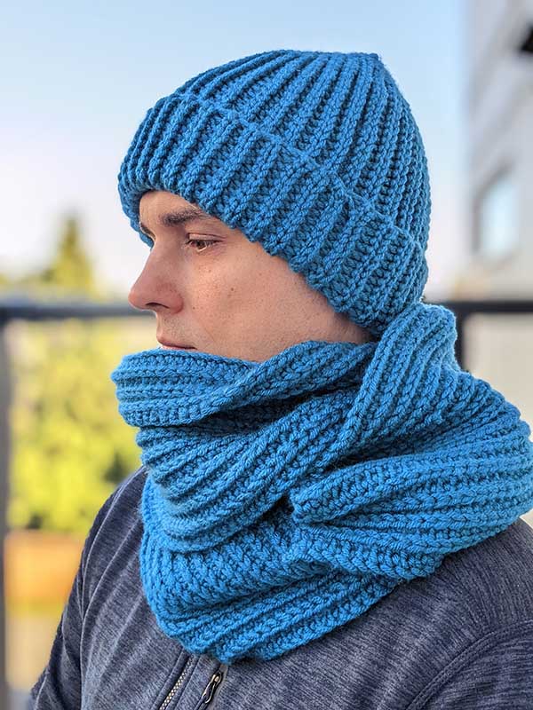 crochet blue men's hat with double brim and scarf on male model - left side view