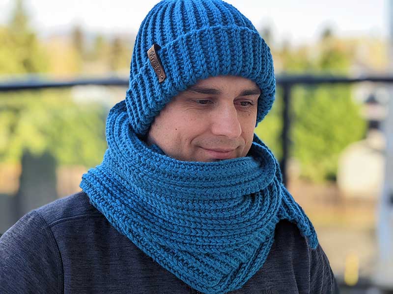 crochet blue men's hat with double brim and scarf on male model - right side view