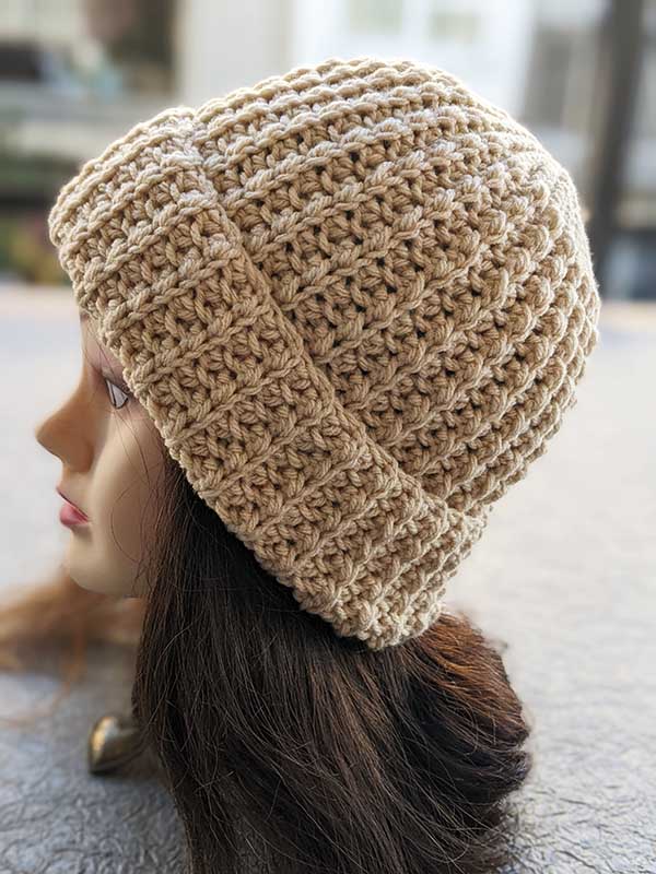 crochet flat unisex hat on a female mannequin head