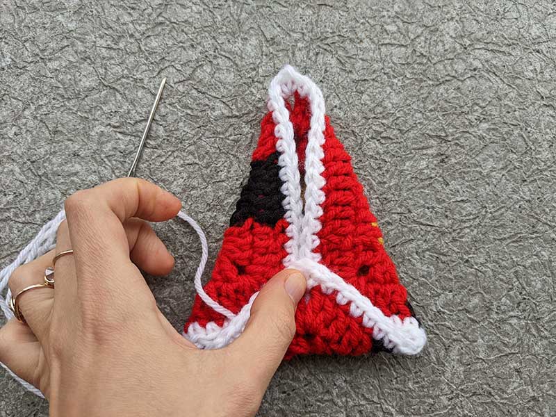 folding and sewing crochet Christmas tree from granny square - step two