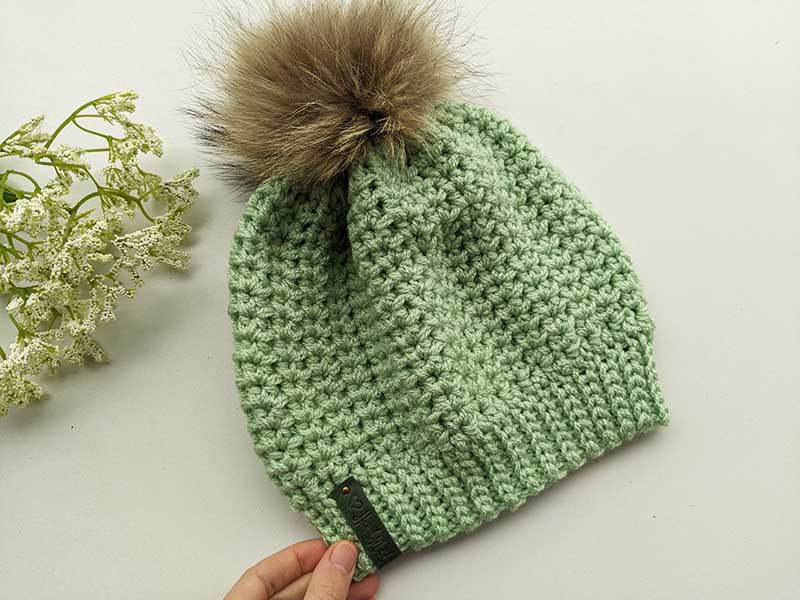 frosty charm crochet beanie with fur pom