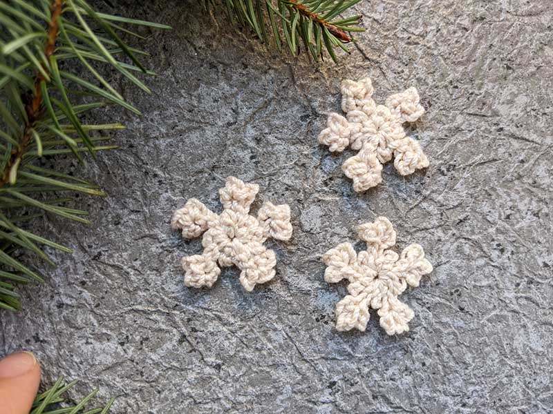 three crochet mini snowflakes made for decor purpose