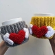 crochet cup cozy with a heart pattern