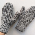 crochet woman's flat mittens on female hands