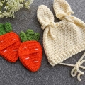crochet carrot pockets next to a crochet bunny hat