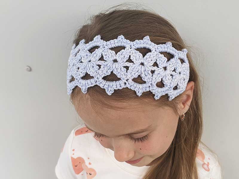 crochet lace headband on a girl model -top view