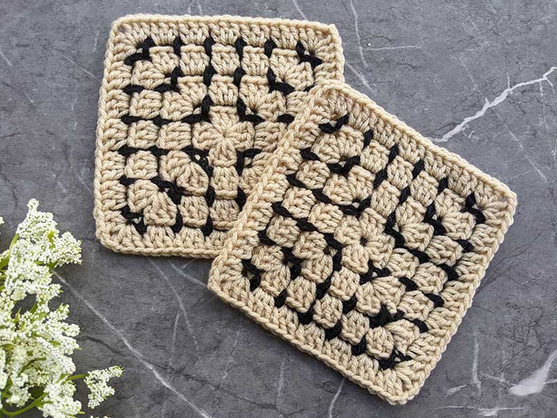 crochet pillow granny square with light brown with black stitches
