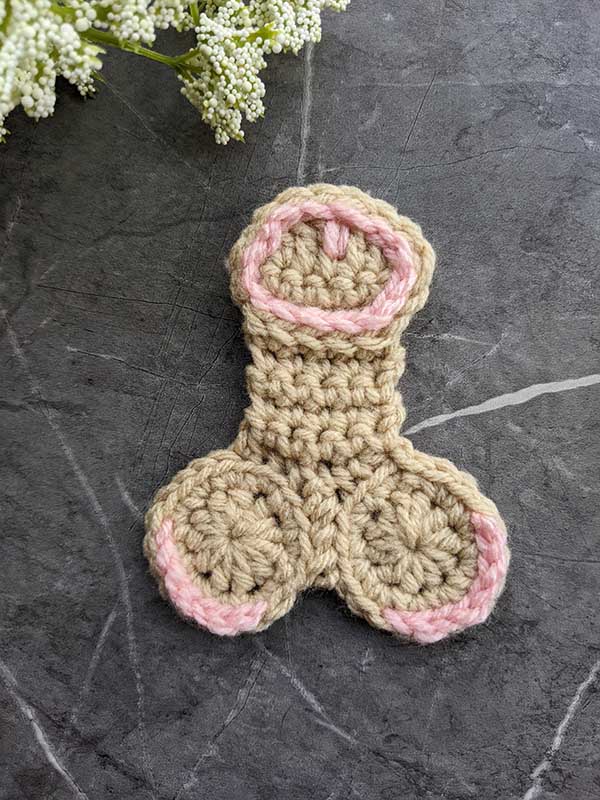 crochet light brown willy with pink decor elements