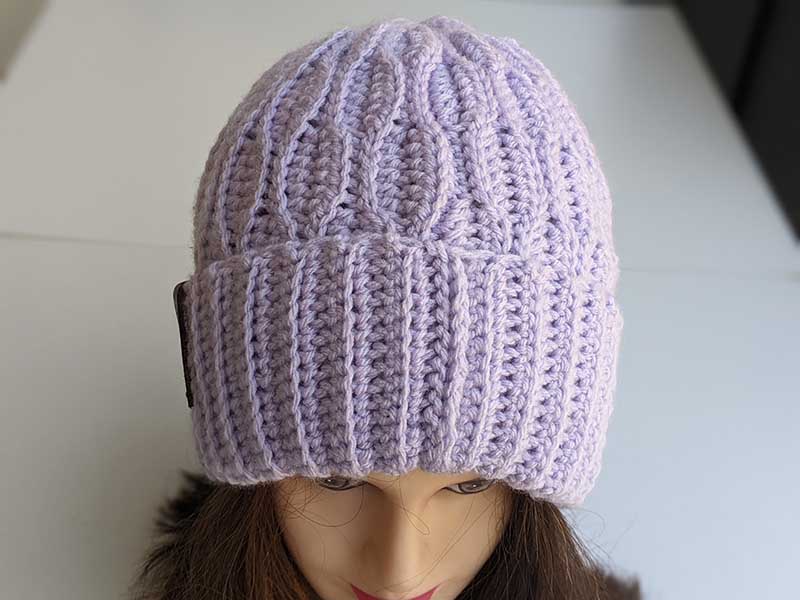 crochet ripple hat on the mannequin's head - front side view