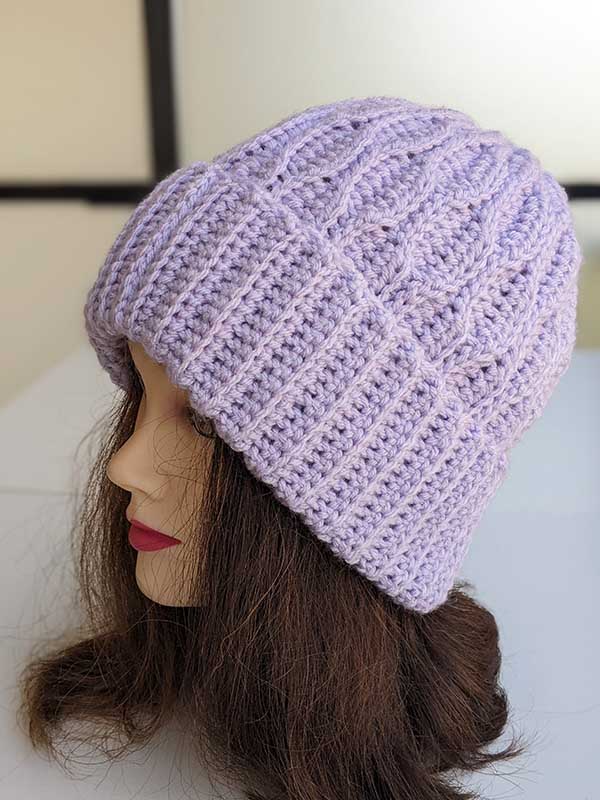 crochet ripple hat on the mannequin's head - left side view