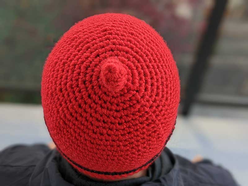 crochet teletubby hat on a male model - crown view
